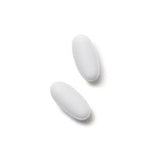 GNC Men's ArginMax capsule close-up on a wooden surface