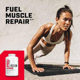 GNC Pro Performance Amino Acid 3000 softgels on a wooden table