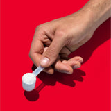 GNC Pro Performance Creatine Monohydrate Powder in a glass of water