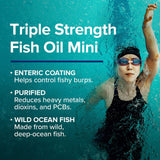GNC Triple Strength Fish Oil softgel bottle on a table