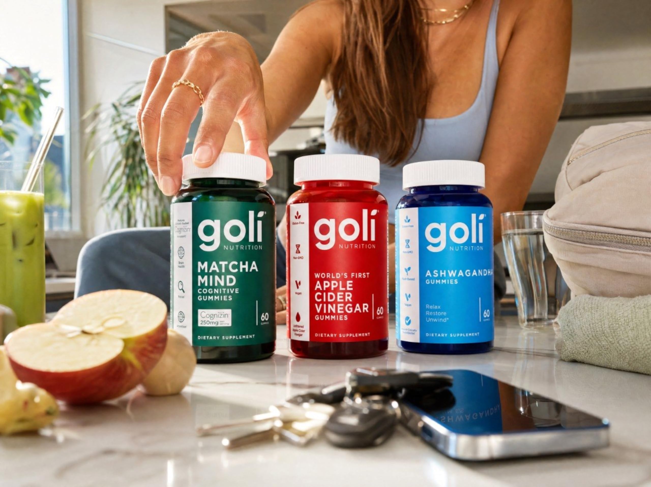 Goli Ashwagandha Capsules bottle with a green plant background