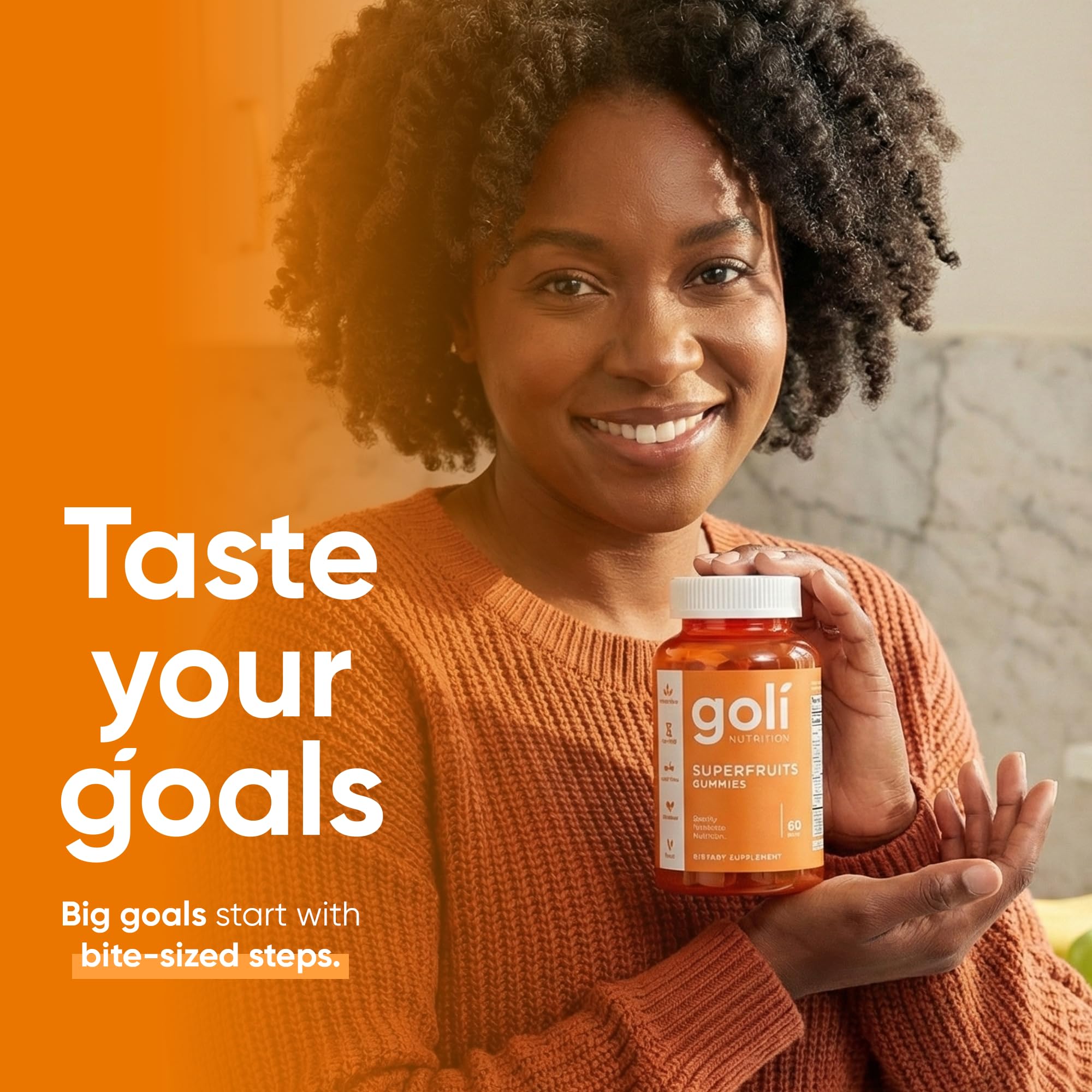 Goli Superfruits Gummies bottle with a hand holding a gummy