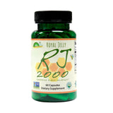 Greenbow Organic Royal Jelly Capsules on a wooden table