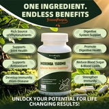 GREENPEOPLE Moringa Capsules on a wooden table