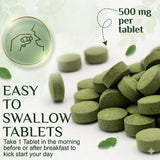 Grenera Organic Moringa Tablets on a wooden table with green leaves