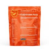 Grüns Immün Daily daily wellness Gummies 240g with a glass of water