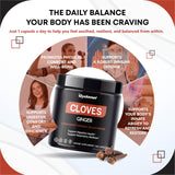 GUDOMET Cloves Supplement capsules on a wooden surface