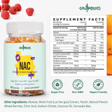 Gyumolics NAC Gummies on a kitchen counter with fresh berries