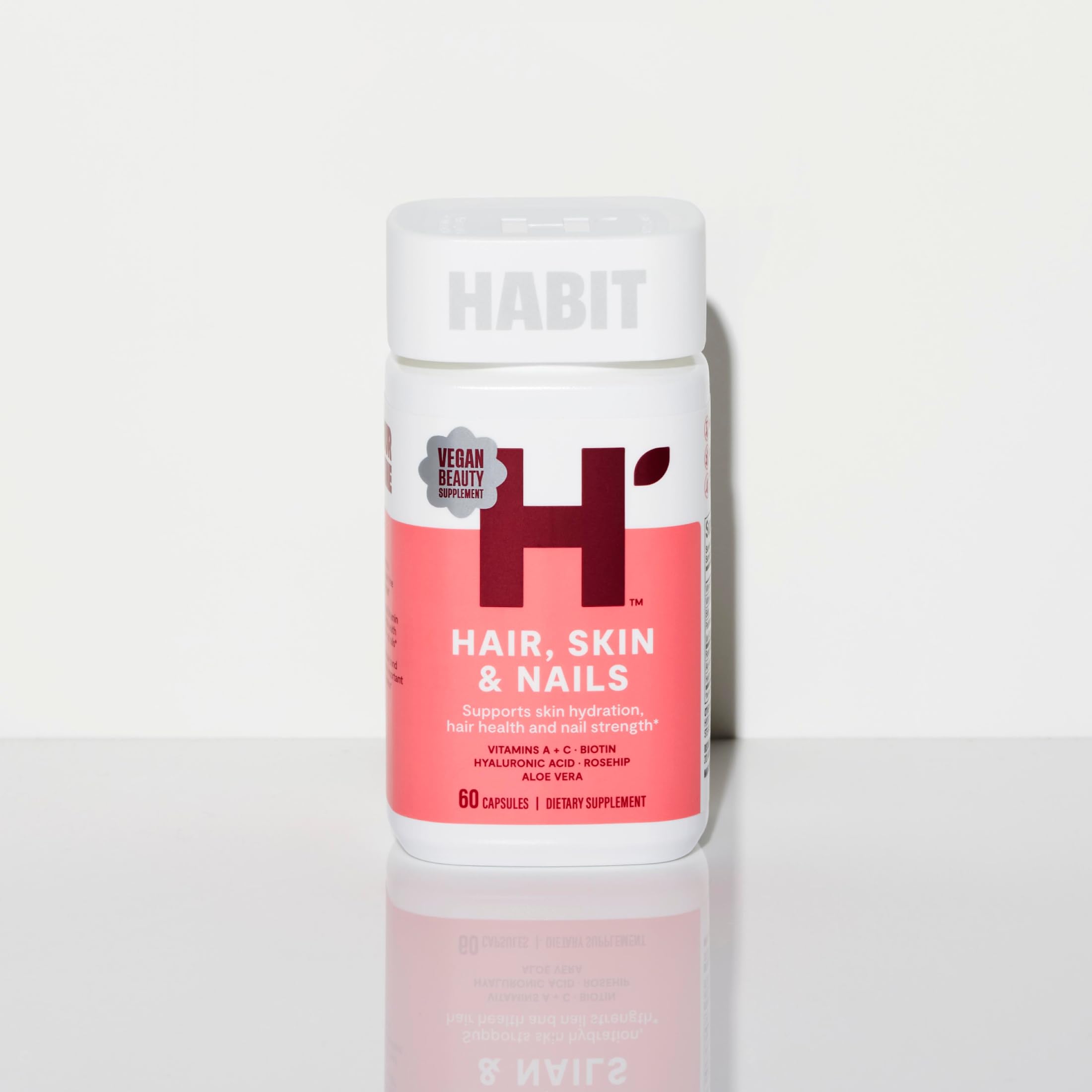 H' Habit Hair, Skin & Nails supplement with natural ingredients background
