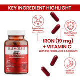 HealthBest Iron Supplement capsules on a wooden table