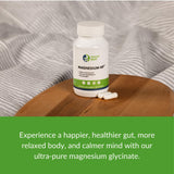 Healthy Gut Magnesium Glycinate Supplement 180mg with a glass of water