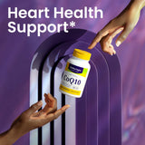 Healthy Origins CoQ10 Ubiquinone 100mg capsules on a wooden table