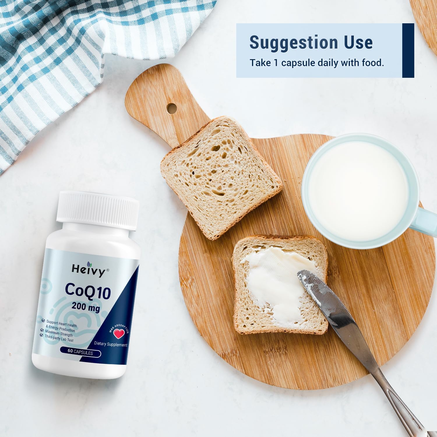 Heivy CoQ10 capsules next to a glass of water