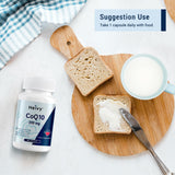Heivy CoQ10 capsules next to a glass of water
