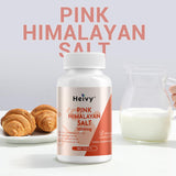 Heivy Pink Himalayan Salt Tablets on a wooden table