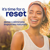 her own Cleanse supplement capsules on a wooden surface