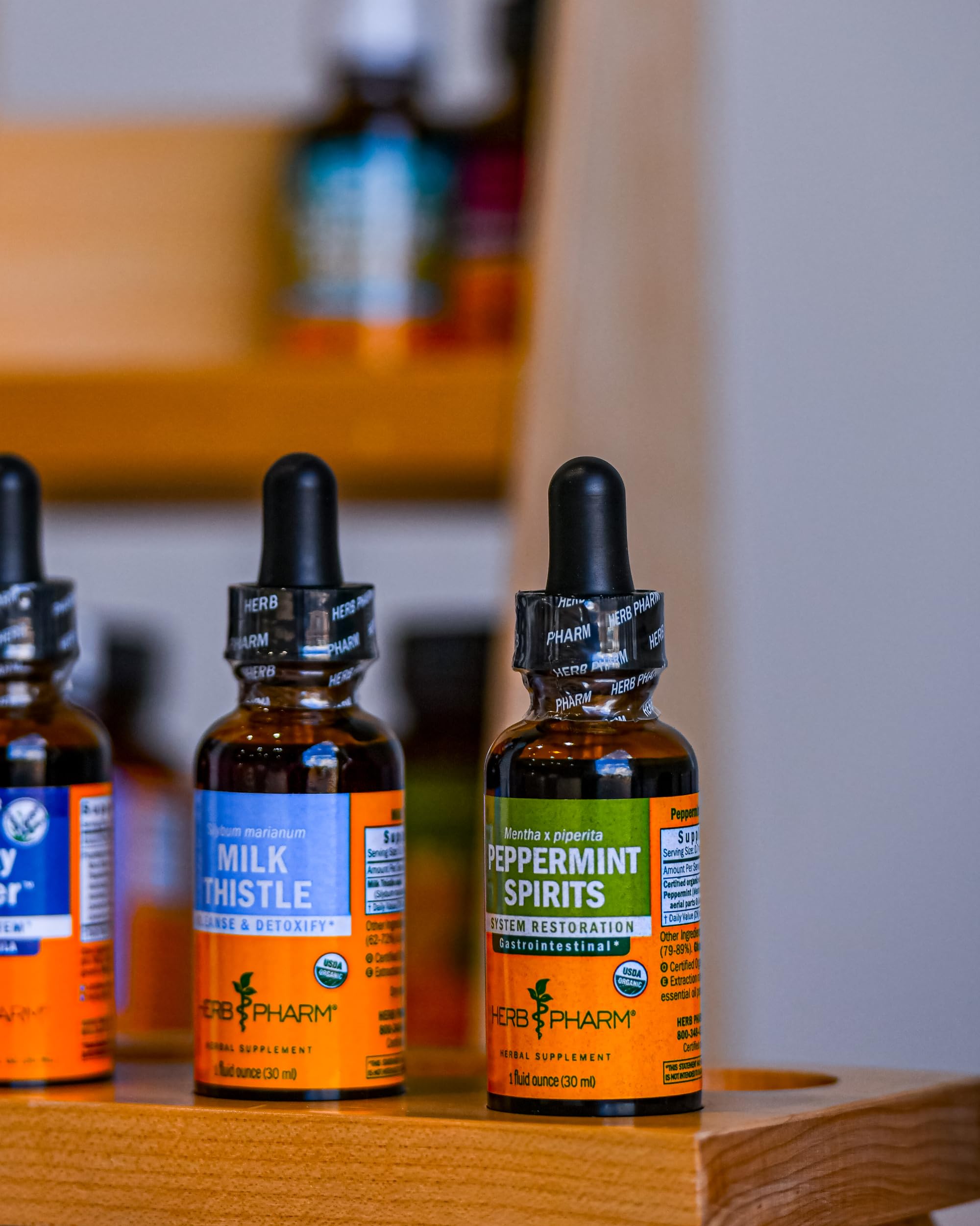 Herb Pharm Milk Thistle Tincture with herbs in background