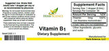 Herb-Science Vitamin B1 Liquid Drops bottle on a wooden surface