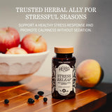 Herbs Etc. Stress ReLeaf Softgels on a wooden table