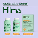Hilma Pre + Probiotic Capsules packaging on a wooden table