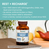 Himalaya Ashwagandha+ daily wellness capsules on a wooden surface
