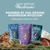Host Defense Reishi Mushroom Gummies on a wooden table