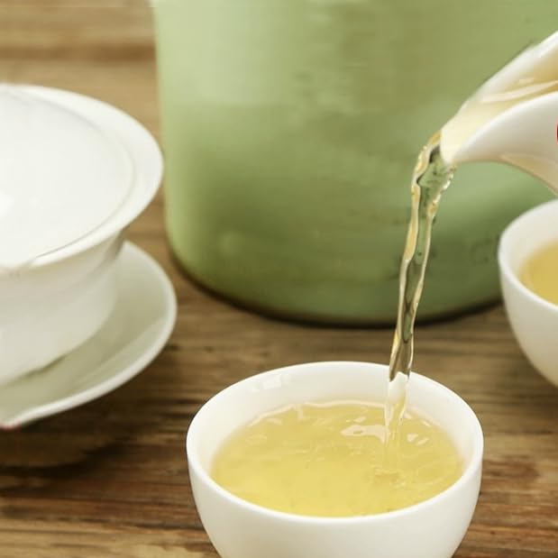 HOYNISE Jasmine Green Tea in a teacup with steam