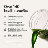 Huel Daily Greens 281g powder in a glass