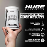 Huge Supplements Creatine Monohydrate 454g in a gym setting