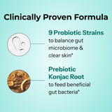 HUM Prebiotic + Probiotic Capsules on a wooden table