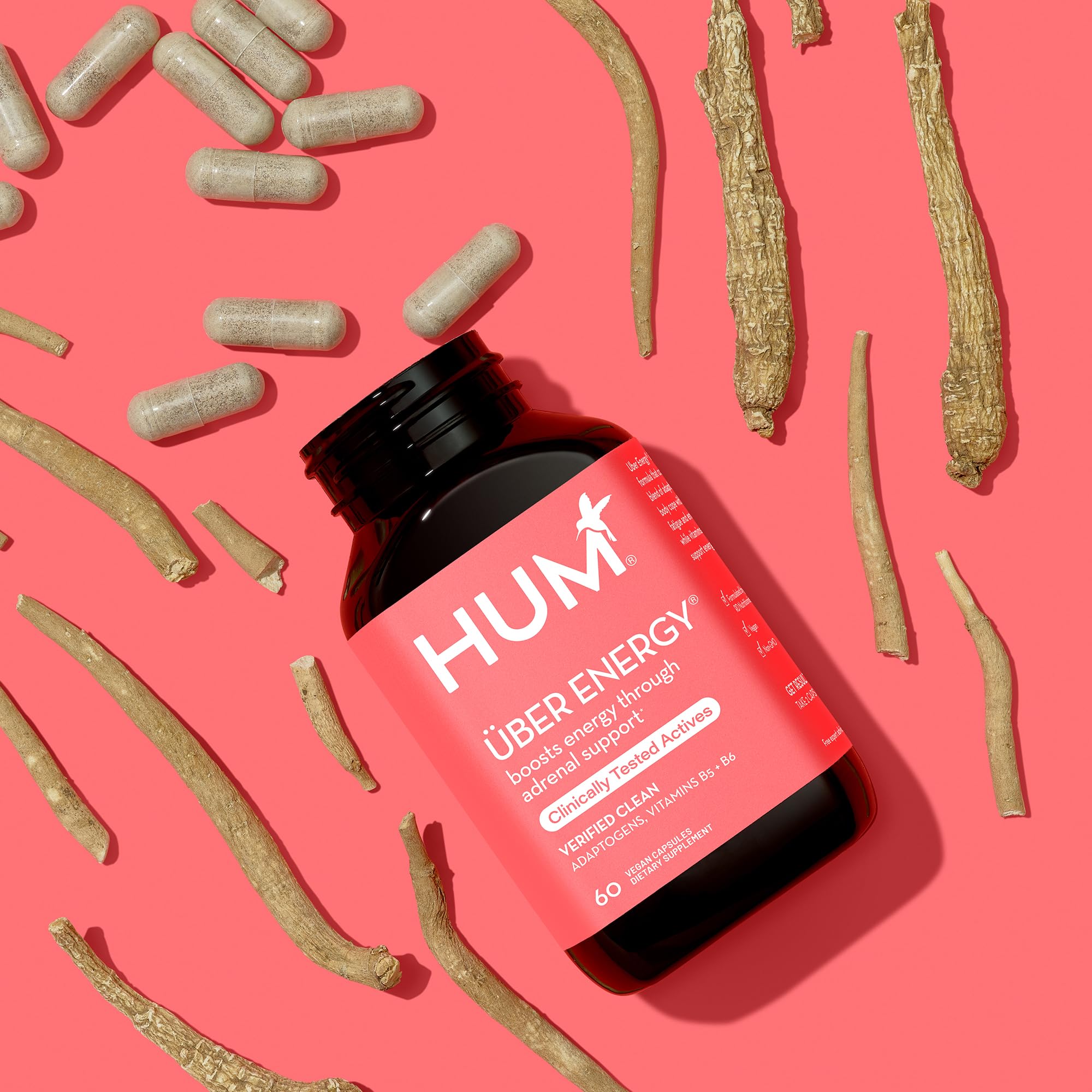 HUM Uber Energy capsules in a clear glass with water