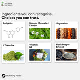 Humming Herbs Apigenin 504mg supplement on a wooden table with a notebook