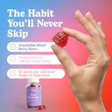 Hunny Bunny Biotin Gummies bottle with a hand reaching for a gummy