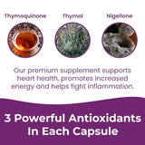 INFINITE AGE Black Seed Extract Capsules on a wooden table