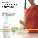 Integrative Therapeutics Active B-Complex capsules with a glass of water