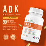INVITA Vitamin ADK Supplement capsules on a table