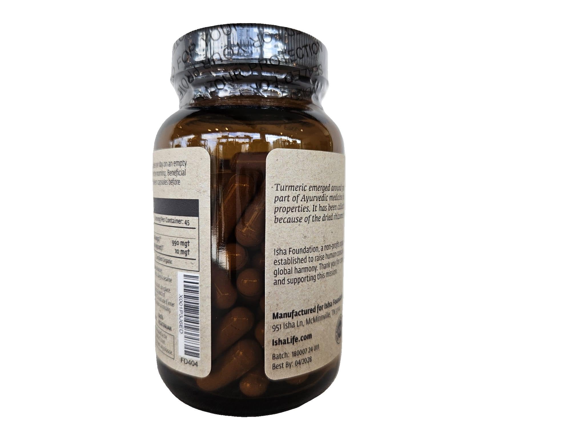 ISHA Organic Turmeric Capsules bottle with warm water