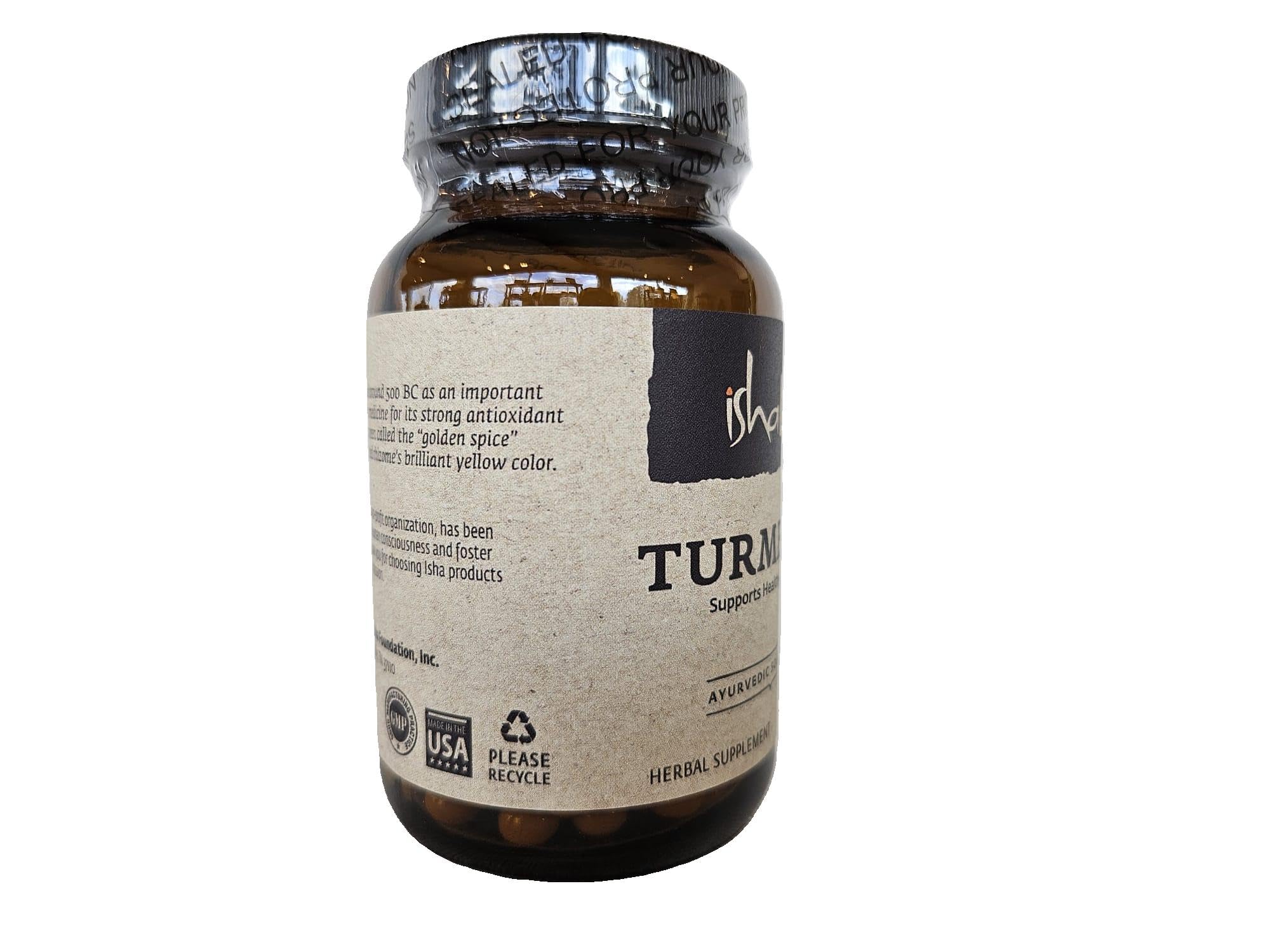 ISHA Organic Turmeric Capsules on a wooden surface
