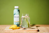 It Works! Simply Aloe mango flavour organic aloe vera juice in a glass with ice