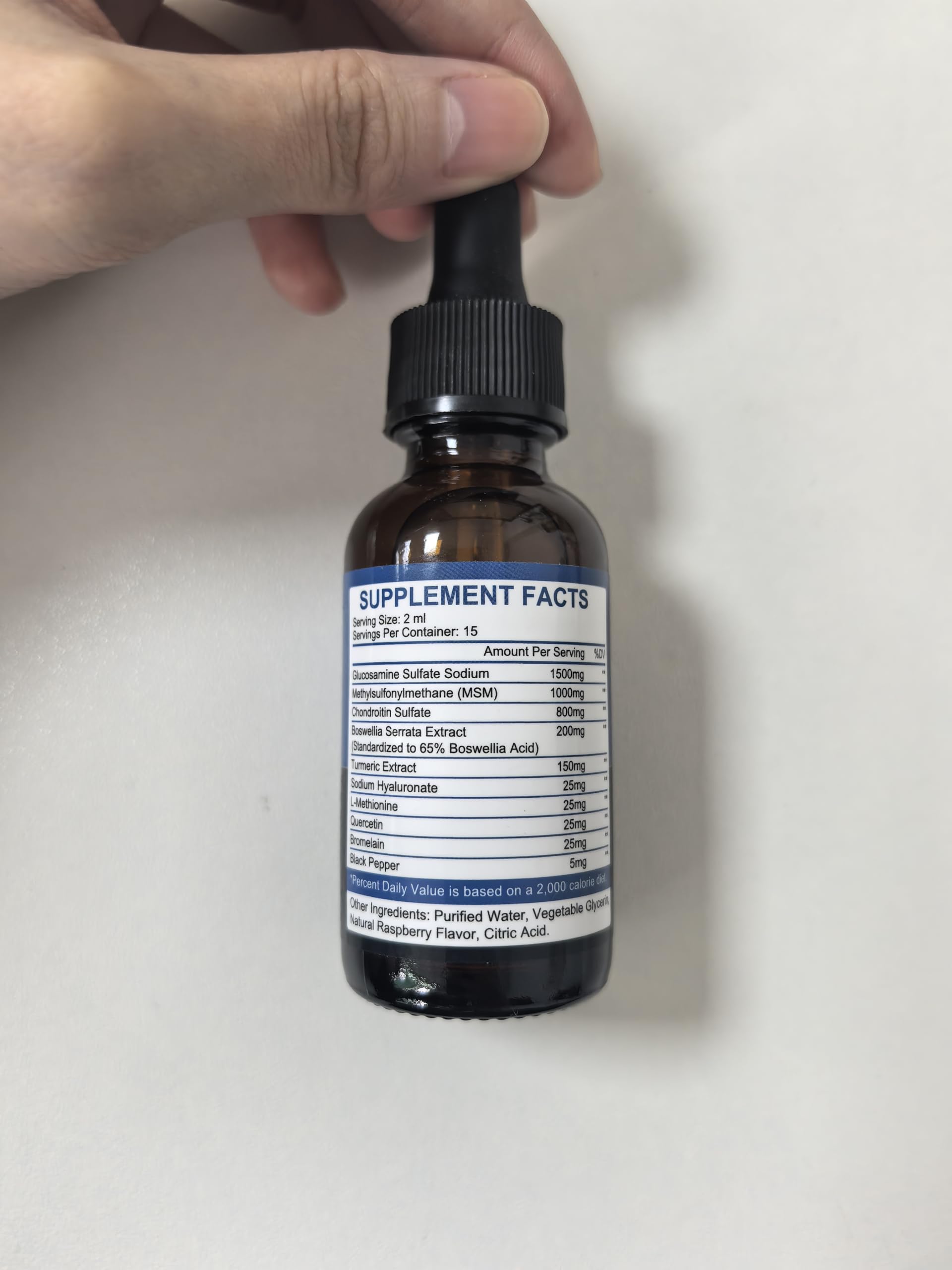 JIANKYTZ Glucosamine Chondroitin MSM Drops in a glass of water