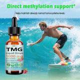 JUIWEFKK TMG Liquid Supplement with fresh raspberries on a wooden table
