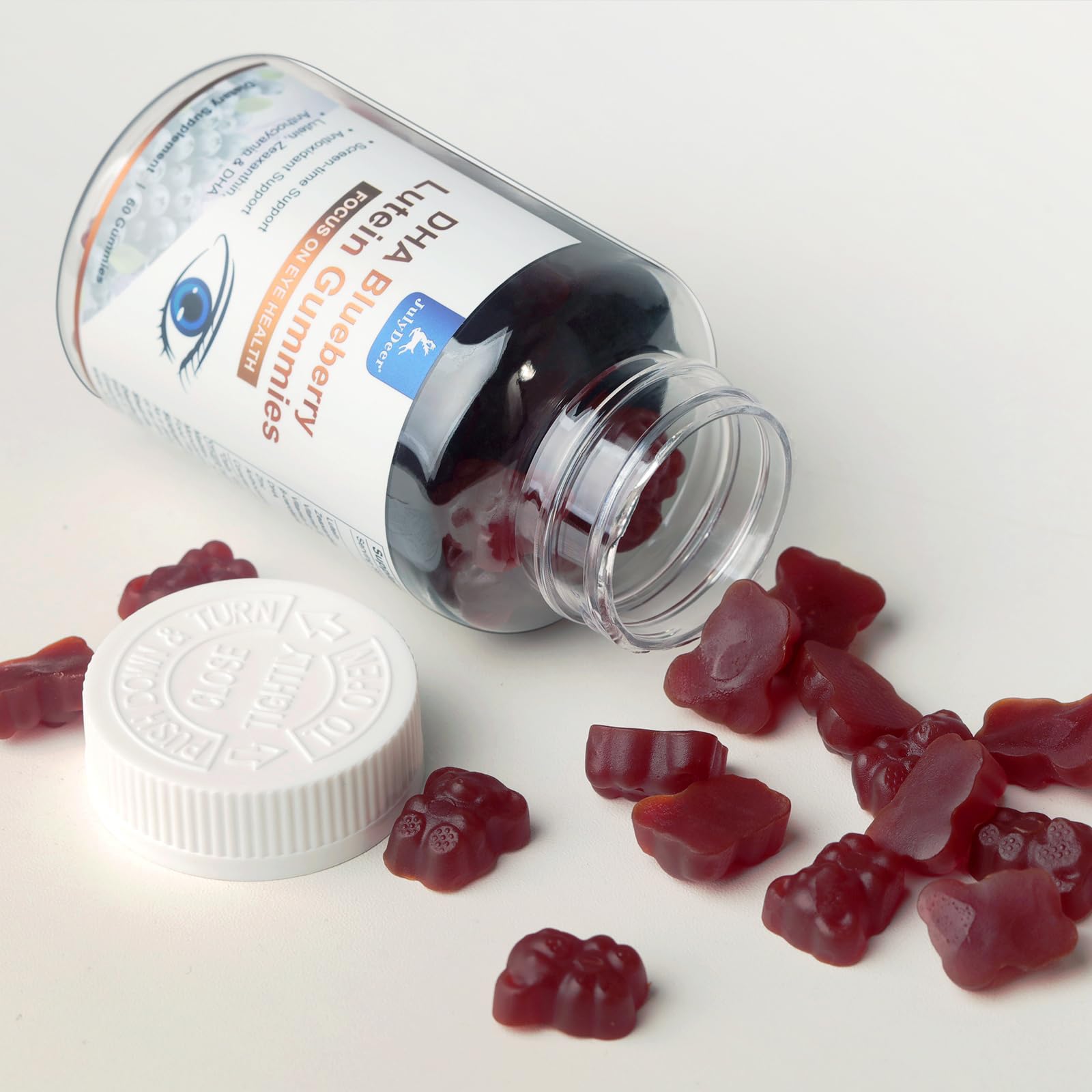 JulyDeer Lutein Gummies displayed with a health book