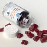 JulyDeer Lutein Gummies displayed with a health book