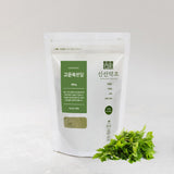 K-Herb Korean Mugwort Powder on a wooden table