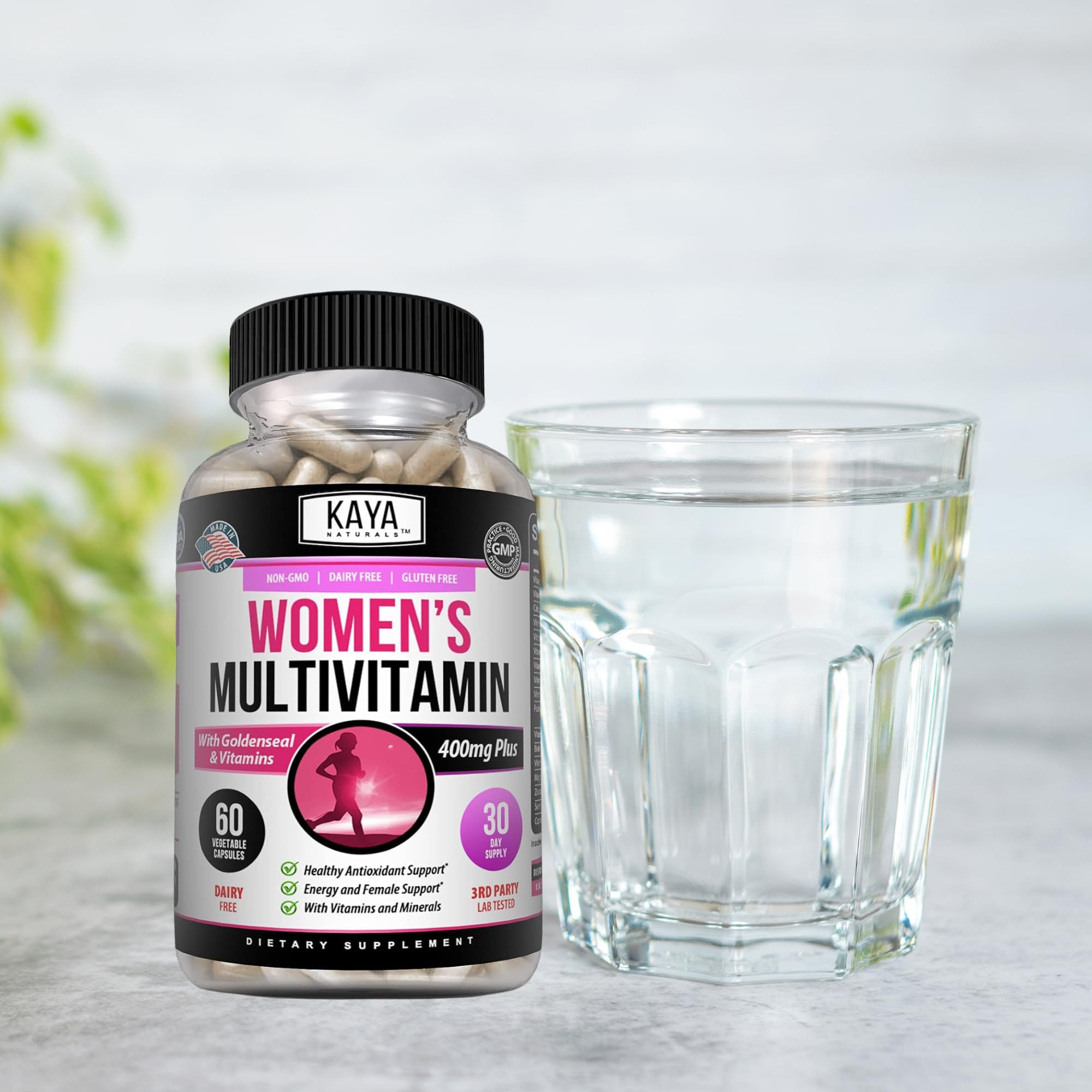Kaya Naturals Women's Multivitamin with a glass of water