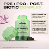 Kiala Nutrition Super Greens Gummies with a hand holding a gummy