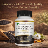 Kueysing Black Seed Oil Softgels on a wooden surface