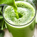 Kuli Kuli Organic Moringa Powder in a bowl with fresh ingredients