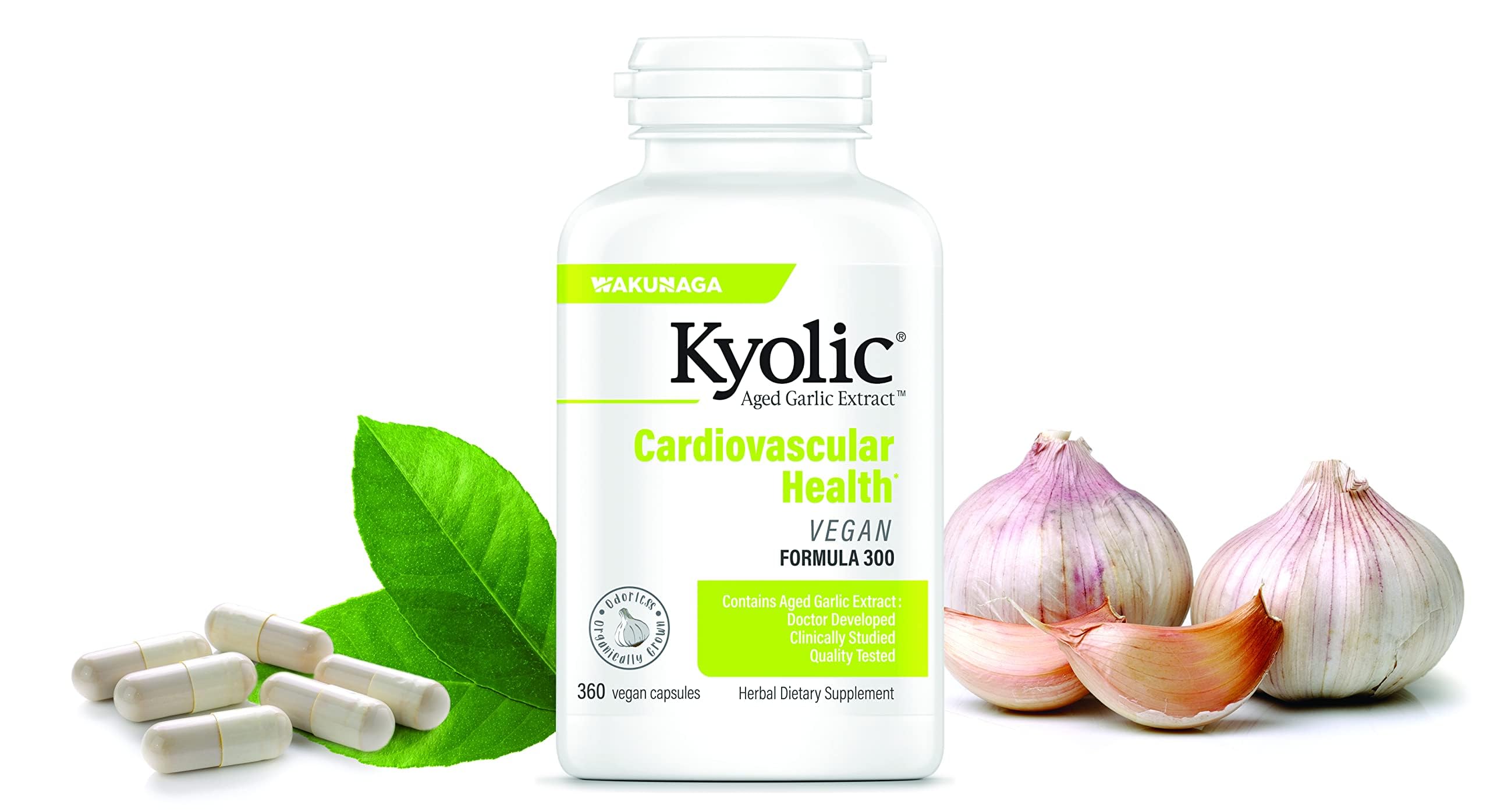 Kyolic Aged Garlic Extract capsules next to fresh garlic