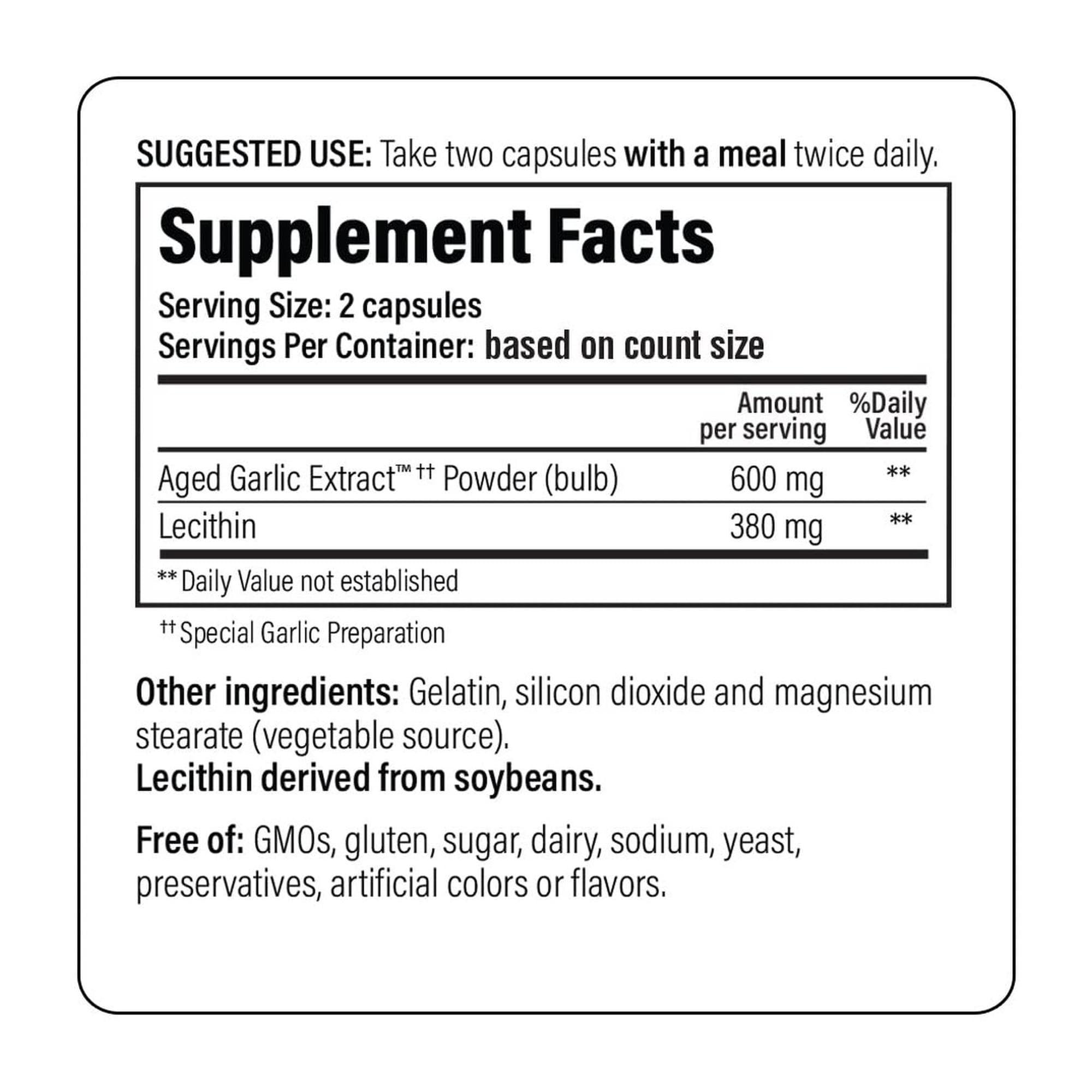 Kyolic Garlic Formula 104 capsules on a wooden table